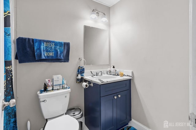 bathroom featuring toilet and vanity