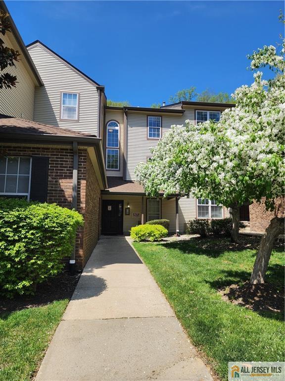 6232 Cedar Ct, South Brunswick, NJ 08852 - view of front of home with brick siding and a front lawn