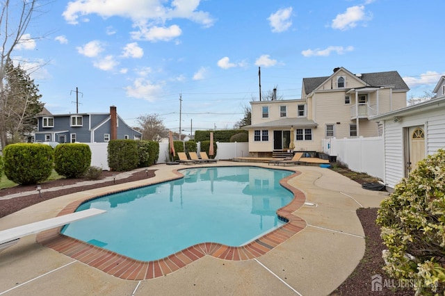 view of swimming pool with a fenced backyard, a patio area, and a fenced in pool