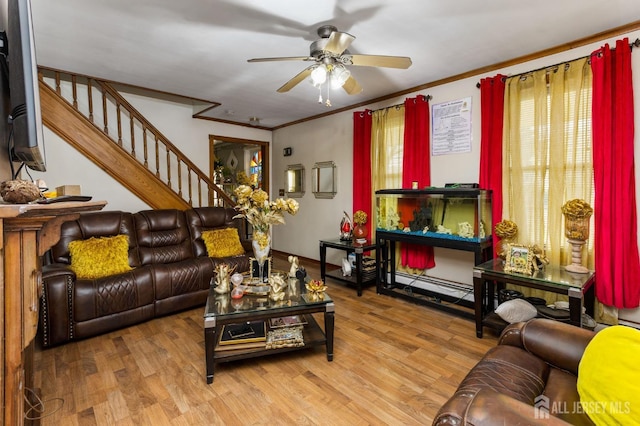living room featuring stairway, crown molding, a ceiling fan, and wood finished floors