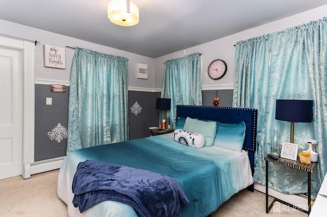 bedroom with a baseboard radiator and carpet floors