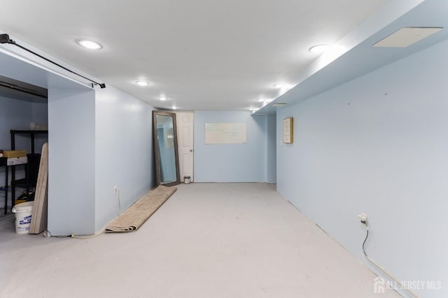 finished basement featuring recessed lighting