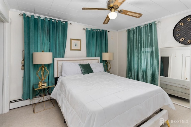 bedroom with ceiling fan, carpet, a baseboard heating unit, and ornamental molding