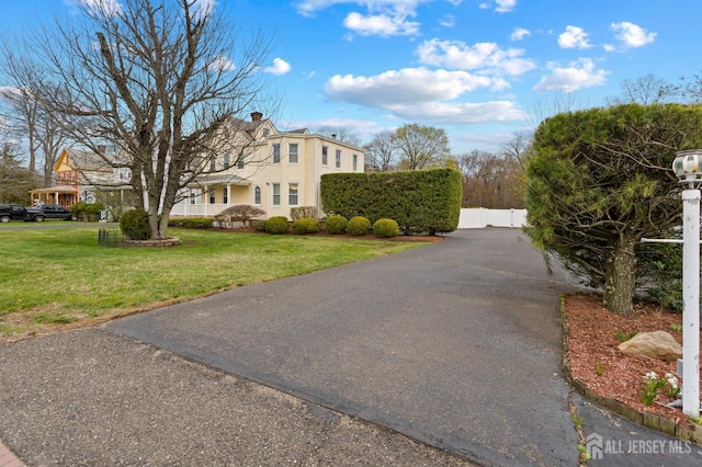 view of street with aphalt driveway