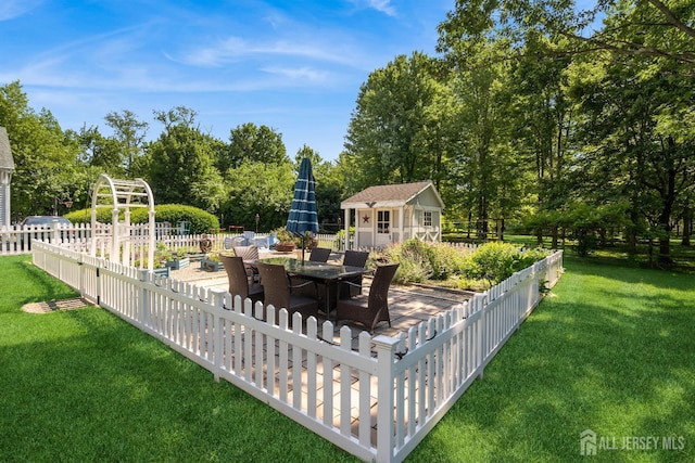59 S Main St, Cranbury, NJ 08512 - view of yard with a storage unit, a patio area, outdoor dining space, and view of wooded area
