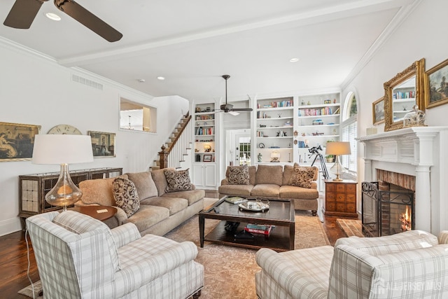 59 S Main St, Cranbury, NJ 08512 - living area featuring a ceiling fan, wood finished floors, stairway, a brick fireplace, and ornamental molding