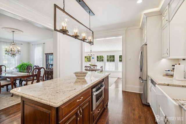 59 S Main St, Cranbury, NJ 08512 - kitchen with a chandelier, appliances with stainless steel finishes, light stone counters, dark wood-style floors, and pendant lighting