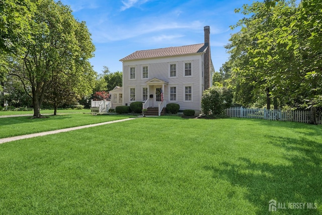59 S Main St, Cranbury, NJ 08512 - colonial-style house featuring a chimney