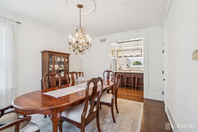 59 S Main St, Cranbury, NJ 08512 - dining space featuring wood finished floors, ornamental molding, and a chandelier