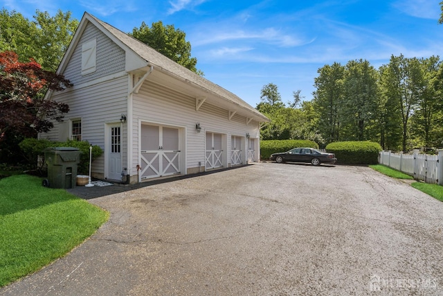 59 S Main St, Cranbury, NJ 08512 - view of property exterior featuring a garage and driveway