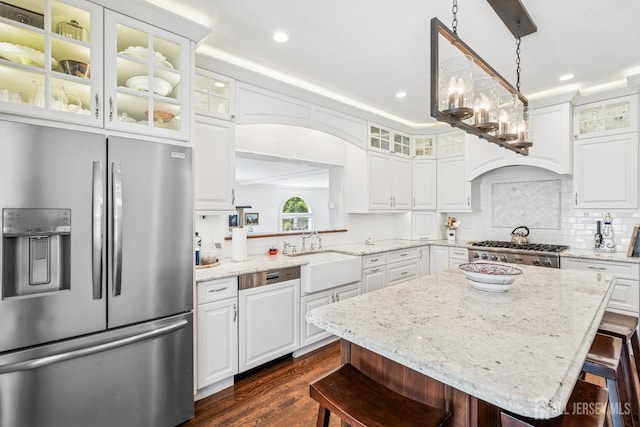 59 S Main St, Cranbury, NJ 08512 - kitchen with appliances with stainless steel finishes, a breakfast bar, dark wood-style floors, white cabinetry, and a kitchen island