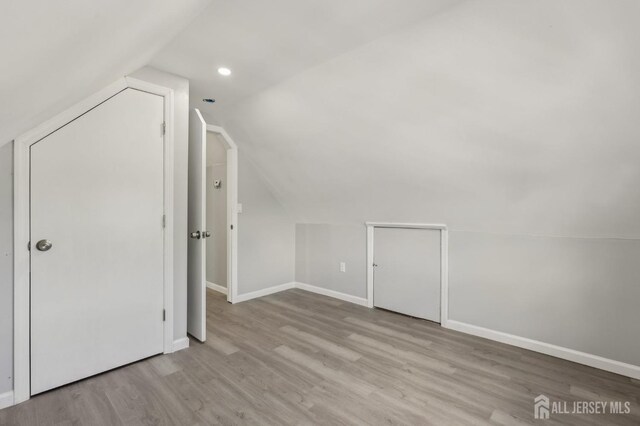 15 Frazer St, Fords, NJ 08863 - bonus room with lofted ceiling, wood finished floors, baseboards, and recessed lighting