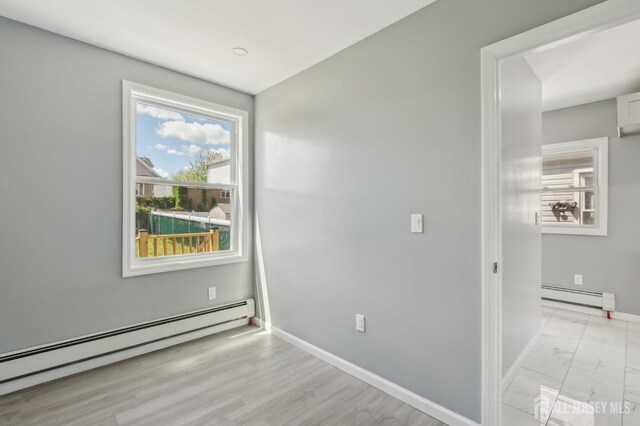 15 Frazer St, Fords, NJ 08863 - empty room featuring baseboard heating and light marble finish floors