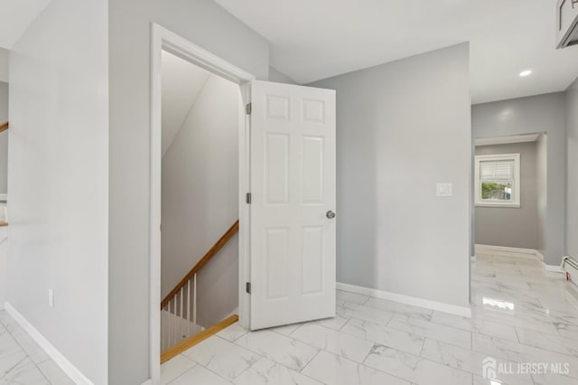unfurnished bedroom with light marble finish floors, baseboards, and recessed lighting