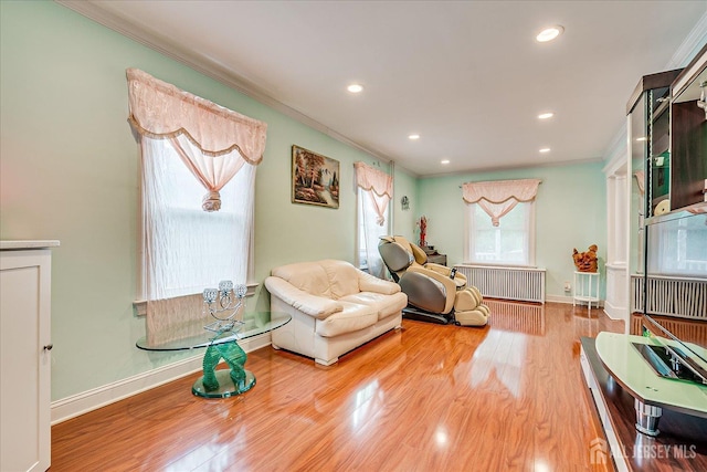 311 Prospect Ave, Dunellen, NJ 08812 - living area featuring crown molding, radiator, recessed lighting, and wood finished floors