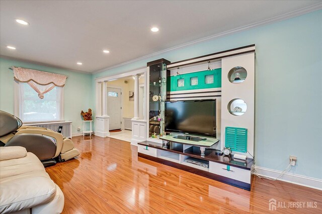 311 Prospect Ave, Dunellen, NJ 08812 - living area featuring crown molding, wood finished floors, decorative columns, and recessed lighting