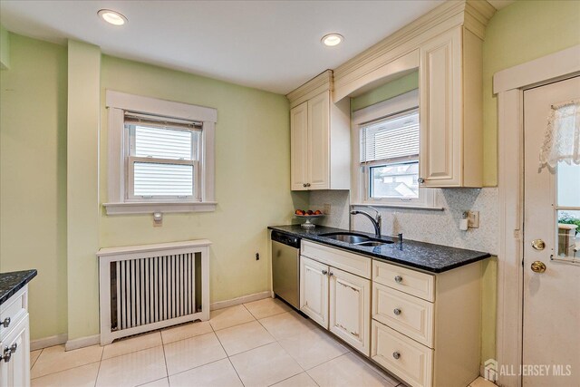 311 Prospect Ave, Dunellen, NJ 08812 - kitchen featuring stainless steel dishwasher, radiator heating unit, cream cabinets, dark stone counters, and recessed lighting