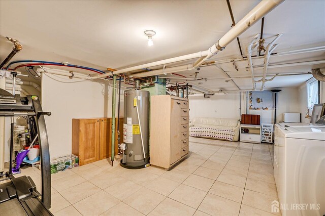 311 Prospect Ave, Dunellen, NJ 08812 - basement featuring water heater, independent washer and dryer, and light tile patterned floors