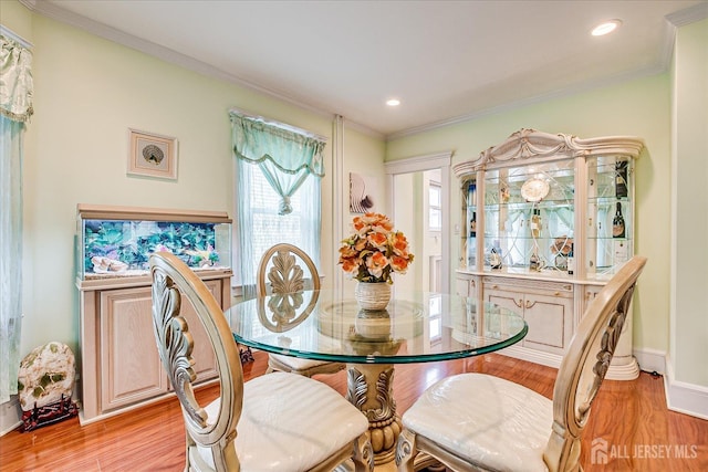 311 Prospect Ave, Dunellen, NJ 08812 - dining space featuring light wood-style floors, ornamental molding, and recessed lighting