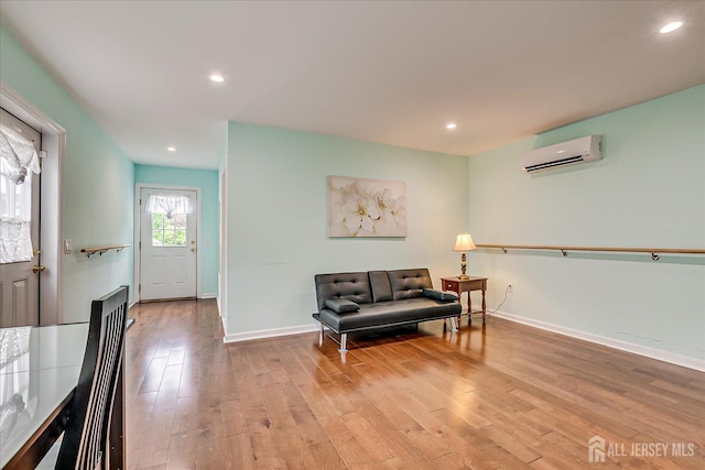 311 Prospect Ave, Dunellen, NJ 08812 - sitting room featuring a wall mounted AC, wood finished floors, and recessed lighting