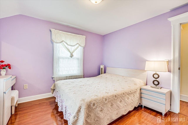 311 Prospect Ave, Dunellen, NJ 08812 - bedroom featuring wood finished floors and lofted ceiling