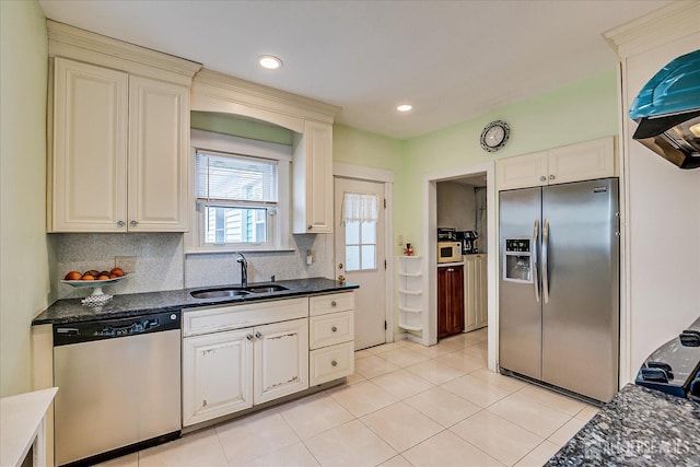 311 Prospect Ave, Dunellen, NJ 08812 - kitchen with appliances with stainless steel finishes, light tile patterned floors, tasteful backsplash, cream cabinets, and recessed lighting