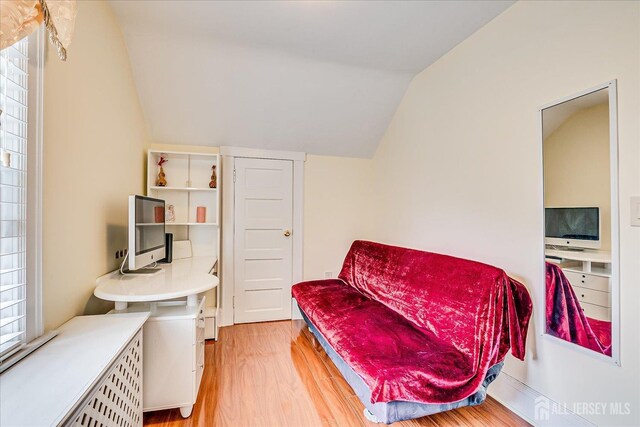 311 Prospect Ave, Dunellen, NJ 08812 - living area featuring lofted ceiling and light wood-type flooring