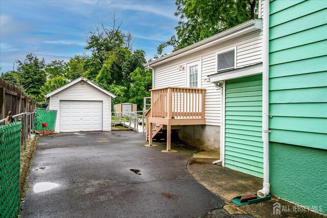 311 Prospect Ave, Dunellen, NJ 08812 - detached garage with asphalt driveway and a shed