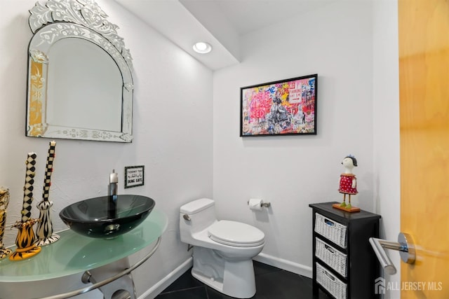 7 Leighton Dr, East Brunswick, NJ 08816 - bathroom featuring toilet, baseboards, tile patterned floors, and a sink