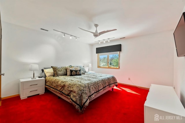 7 Leighton Dr, East Brunswick, NJ 08816 - bedroom featuring a ceiling fan, track lighting, dark carpet, baseboards, and visible vents