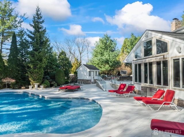 7 Leighton Dr, East Brunswick, NJ 08816 - pool featuring fence, an outdoor structure, a storage unit, and a patio