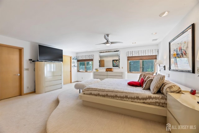 7 Leighton Dr, East Brunswick, NJ 08816 - carpeted bedroom featuring visible vents, ceiling fan, and multiple windows