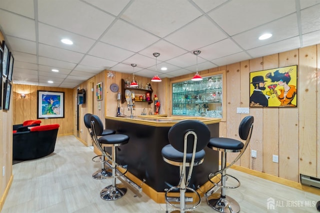 7 Leighton Dr, East Brunswick, NJ 08816 - bar with wet bar, wood walls, baseboards, and a drop ceiling