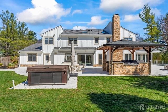 7 Leighton Dr, East Brunswick, NJ 08816 - back of property featuring a patio, a hot tub, area for grilling, and fence