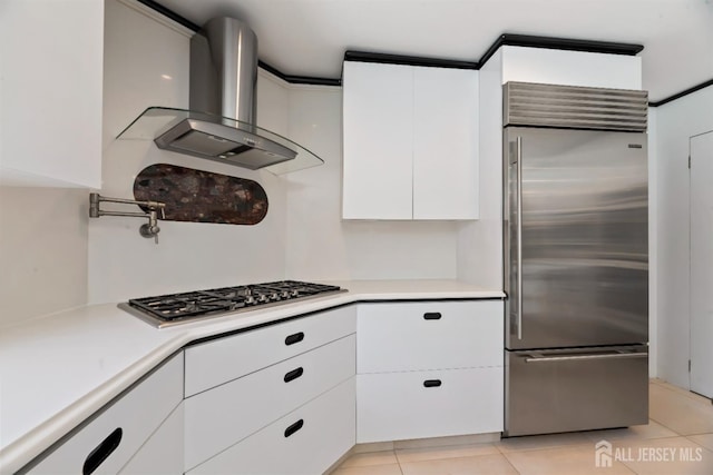 7 Leighton Dr, East Brunswick, NJ 08816 - kitchen featuring white cabinets, stainless steel appliances, light countertops, and wall chimney range hood
