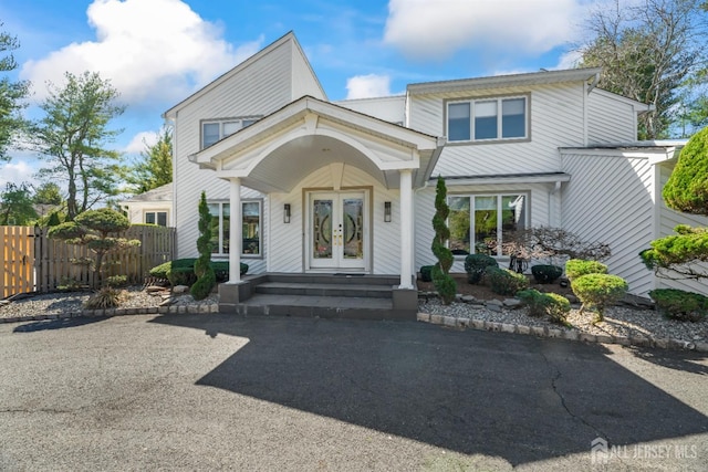 7 Leighton Dr, East Brunswick, NJ 08816 - view of front facade with french doors and fence