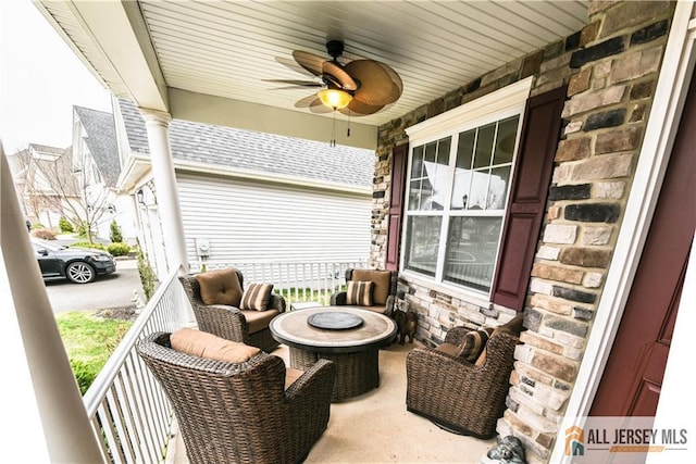 view of patio with a ceiling fan and a porch