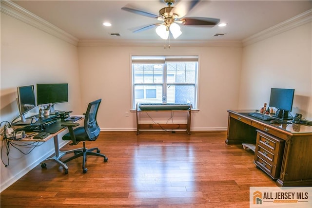 office featuring wood finished floors, visible vents, ornamental molding, baseboards, and ceiling fan