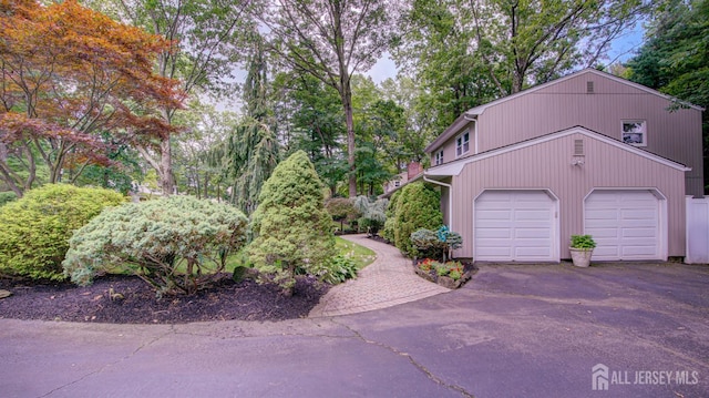 15 Timber Rd, East Brunswick, NJ 08816 - view of home's exterior featuring driveway and an attached garage