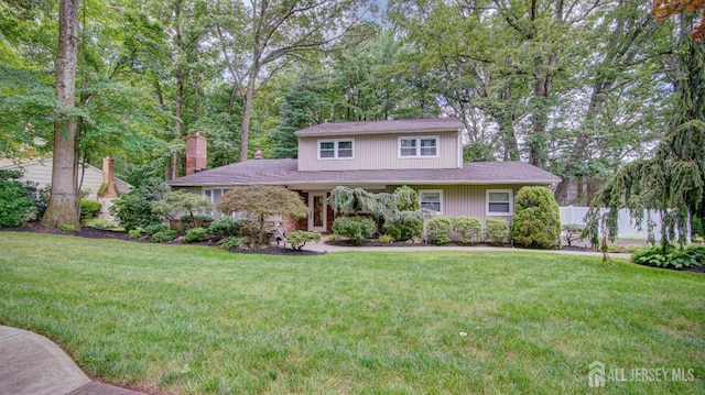 15 Timber Rd, East Brunswick, NJ 08816 - traditional-style house featuring a chimney