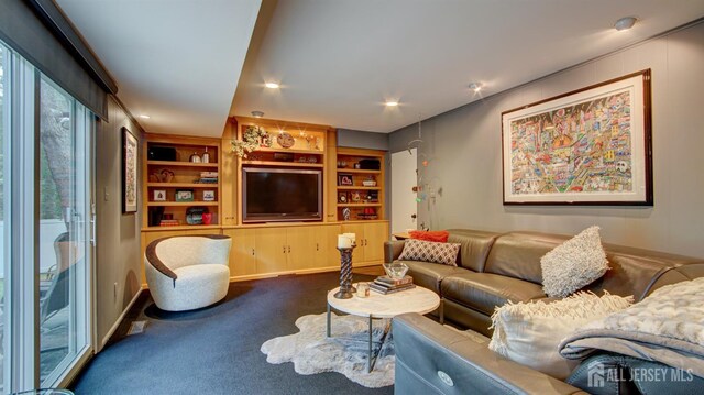15 Timber Rd, East Brunswick, NJ 08816 - carpeted living room with built in shelves, recessed lighting, and plenty of natural light