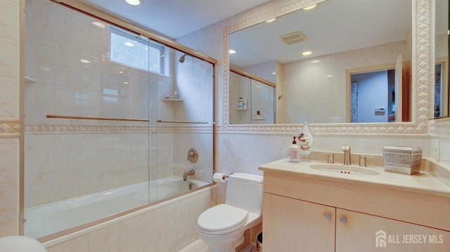 15 Timber Rd, East Brunswick, NJ 08816 - bathroom featuring tile walls, tiled shower / bath, vanity, and recessed lighting