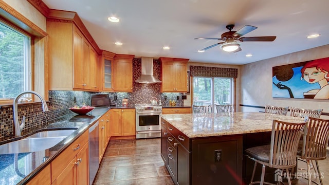 15 Timber Rd, East Brunswick, NJ 08816 - kitchen featuring appliances with stainless steel finishes, wall chimney exhaust hood, a ceiling fan, light stone countertops, and a kitchen breakfast bar