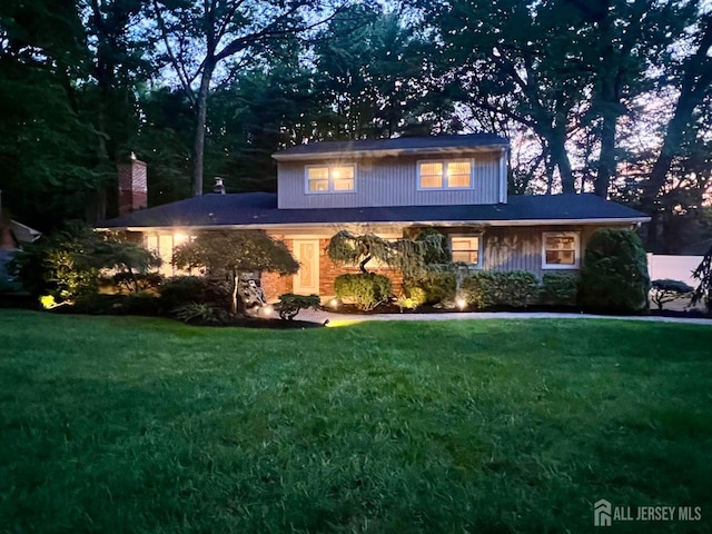 15 Timber Rd, East Brunswick, NJ 08816 - view of front of home featuring a front yard and a chimney