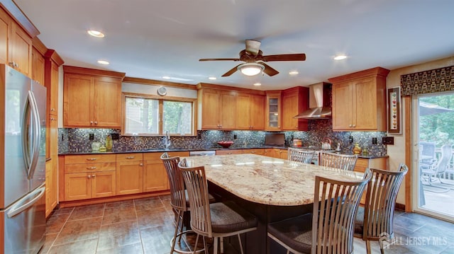 15 Timber Rd, East Brunswick, NJ 08816 - kitchen with freestanding refrigerator, wall chimney range hood, a breakfast bar, a center island, and recessed lighting