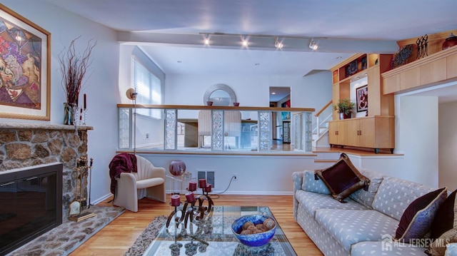 15 Timber Rd, East Brunswick, NJ 08816 - living room featuring wood finished floors, stairs, a fireplace, and track lighting