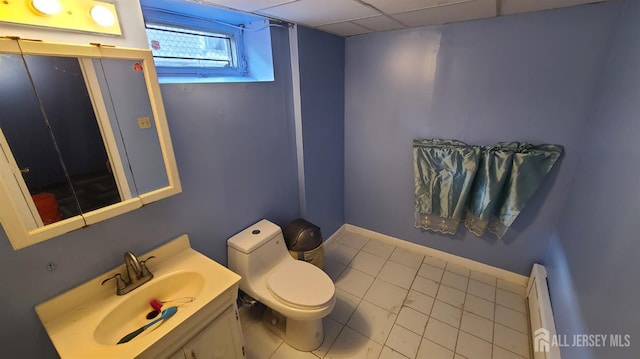 354 Alpine St, Perth Amboy, NJ 08861 - half bathroom with vanity, tile patterned floors, and baseboard heating