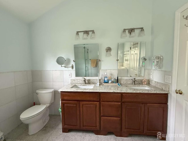 117 Providence Blvd, South Brunswick, NJ 08824 - bathroom featuring wainscoting, a shower stall, double vanity, and tile walls