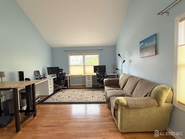 117 Providence Blvd, South Brunswick, NJ 08824 - living area featuring lofted ceiling, a desk, and light wood-type flooring