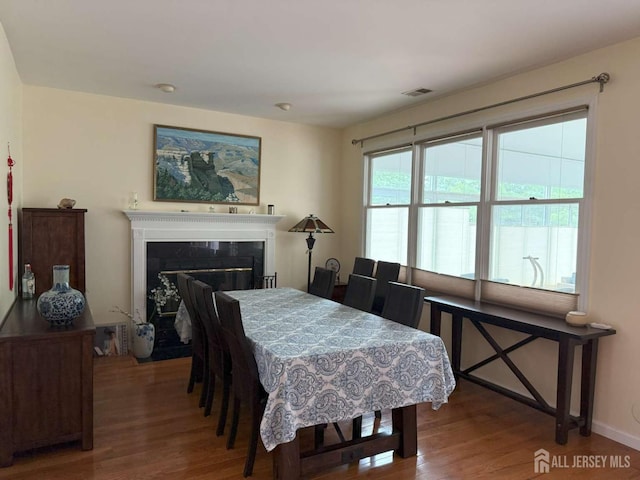 117 Providence Blvd, South Brunswick, NJ 08824 - dining space featuring wood finished floors and a fireplace with flush hearth